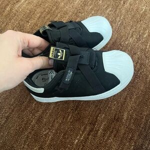Adidas Kids Black and White Sneakers with Gold Accents